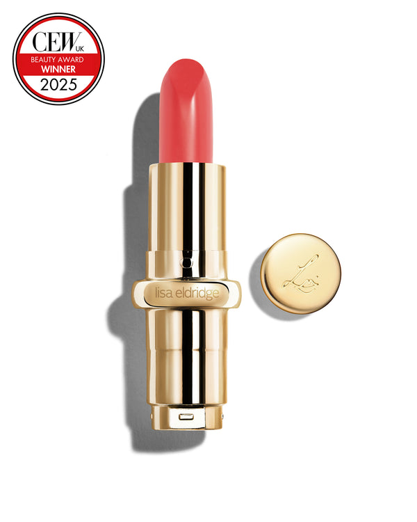 Salmon pink coloured lipstick with gold casing and 'Lisa Eldridge' branding on a white background, featuring a CEW Beauty Award 2025 badge.