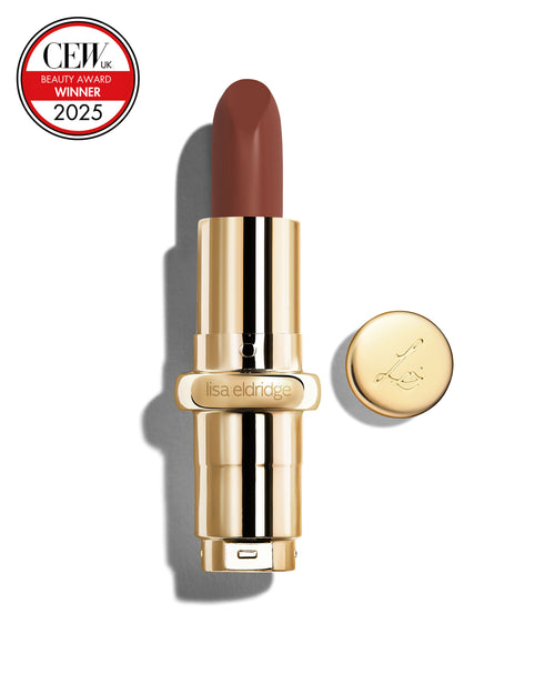 Chocolate coloured red lipstick with gold casing and 'Lisa Eldridge' branding on a white background, featuring a CEW Beauty Award 2025 badge.