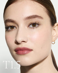 The white pod packaging of Seamless Skin Enhancing Tint by Lisa Eldridge