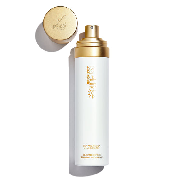 White bottle with gold lettering: Lisa Eldridge Skin and Makeup Enhancing Mist, with spray top and lid in gold primary_meta_image