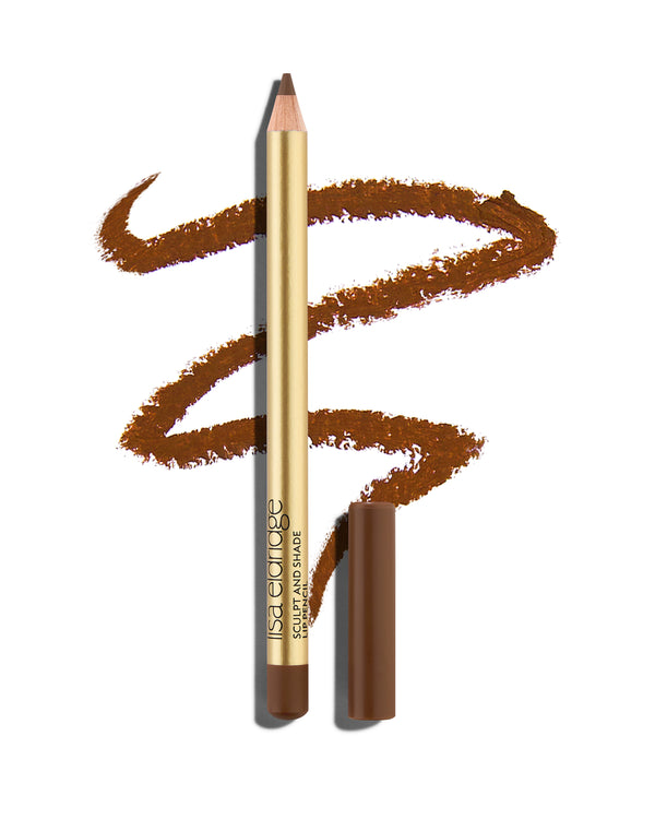 block Cork brown lip pencil with gold barrel and shade-matching cap, shown with a shade swatch behind, demonstrating the product's tones and texture.