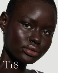 block The white pod packaging of Seamless Skin Enhancing Tint by Lisa Eldridge