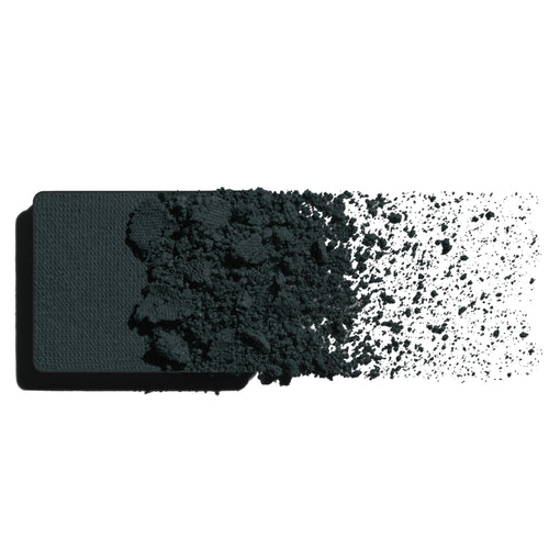 Makeup eyeshadow refill with inky teal powder on a white background